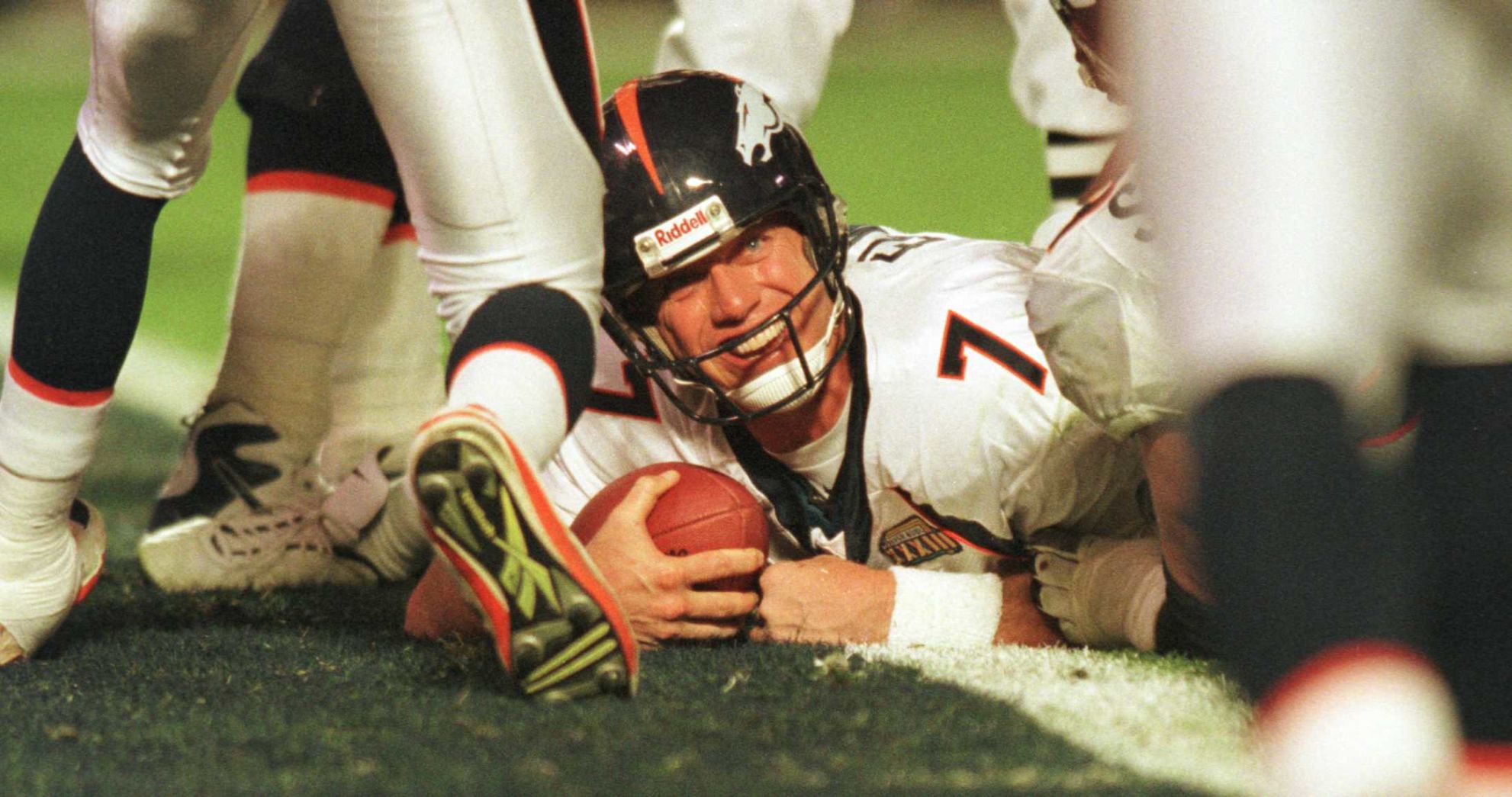 John Elway is all smiles as he lays across the goal line following his fourth quarter touchdown run. PHOTO BY MARK REIS (copy)